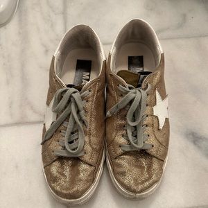 Golden Goose gold sneakers